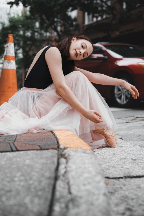 Free A young ballerina in a tutu gracefully poses on a city street in Orlando, Florida. Stock Photo