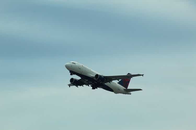 Airplane Flying On Sky