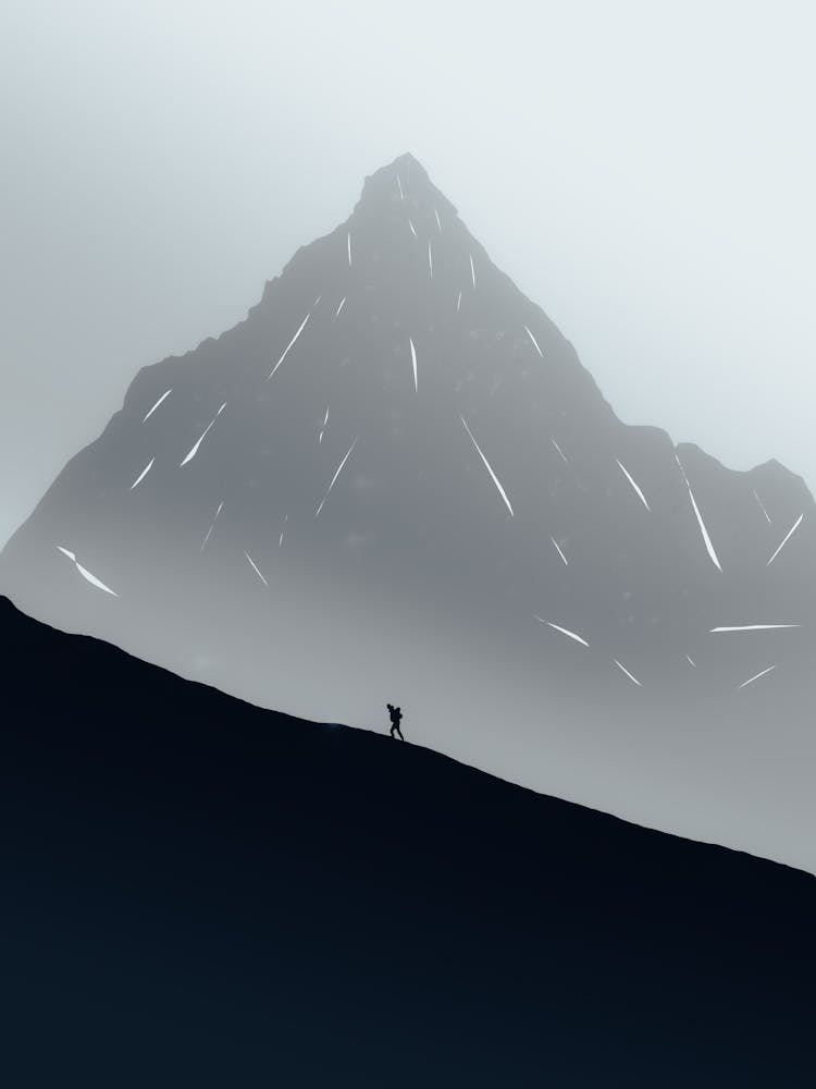 A Person Hiking A Mountain Slope