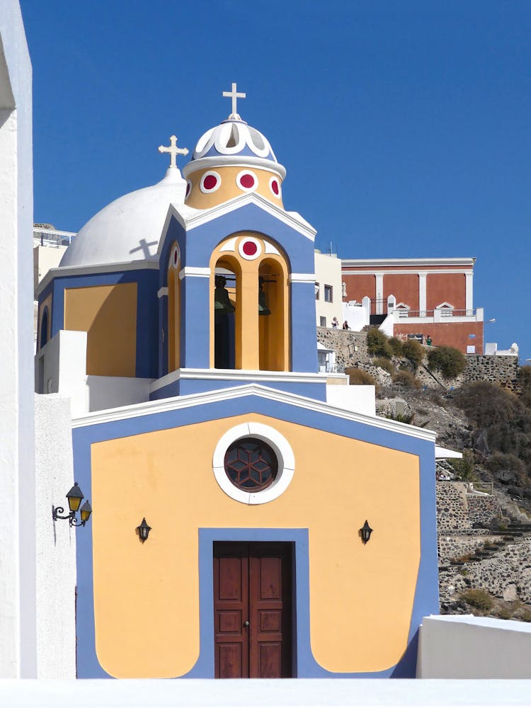 Catholic Church Of Saint Stylianos In Thira, Santorini,  Greece Under Blue Sky