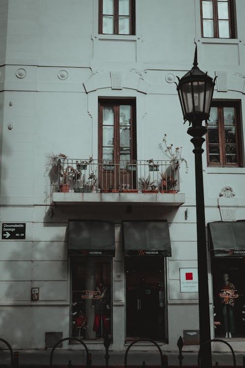 Street Lamp near Balcony in Building