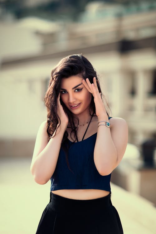 A Beautiful Woman in Blue Tank Top Smiling