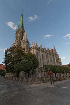 Stunning neo-gothic church in Mühlhausen, Germany, highlighting intricate architecture and towering spire.