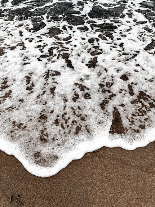 Foamy Waves Washing up the Beach 