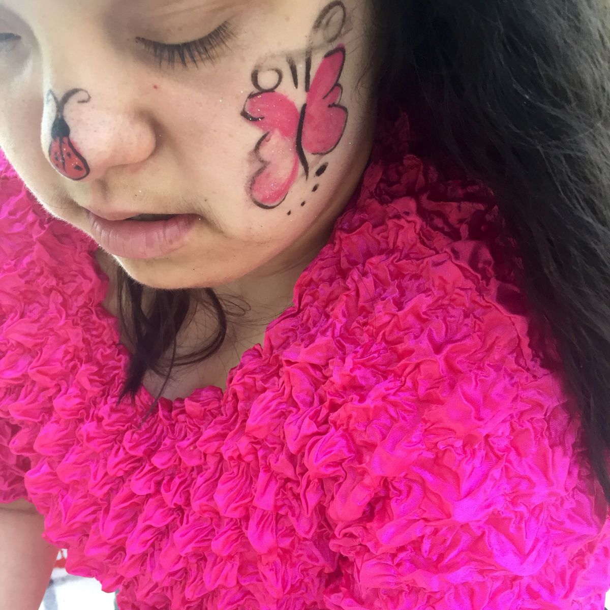 A smiling young person with Down syndrome