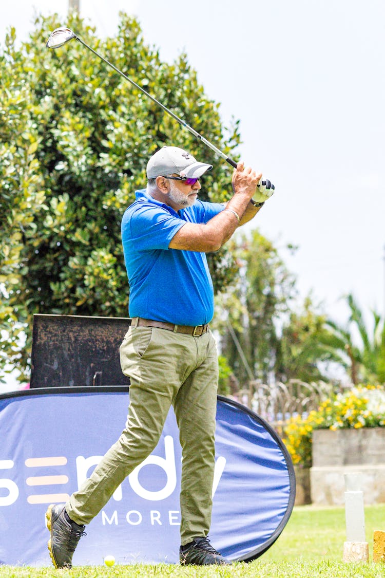 Senior Man Hitting With Golf Club