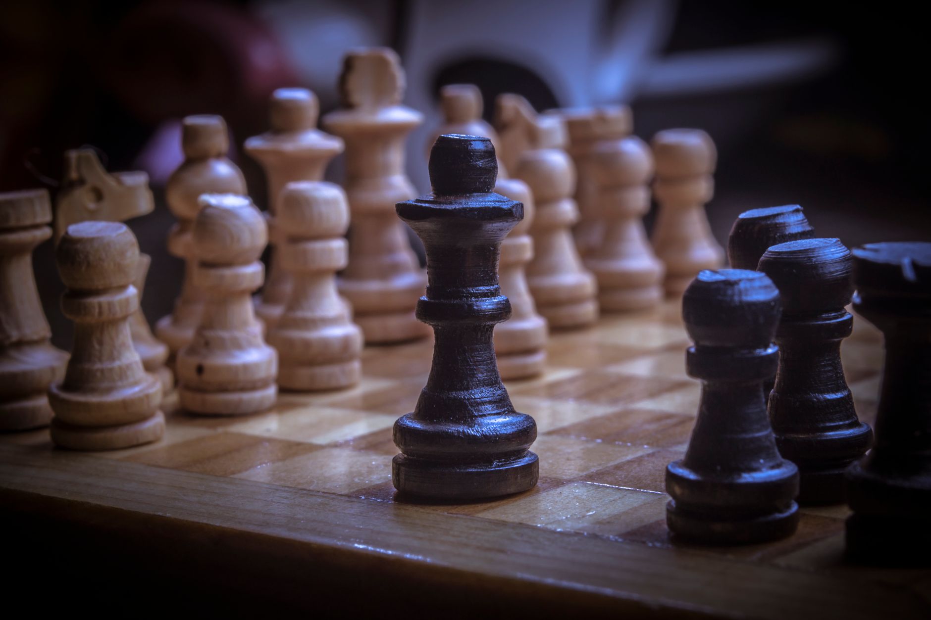 Intense close-up view of chess pieces, focusing on strategy and tactic elements in the game.