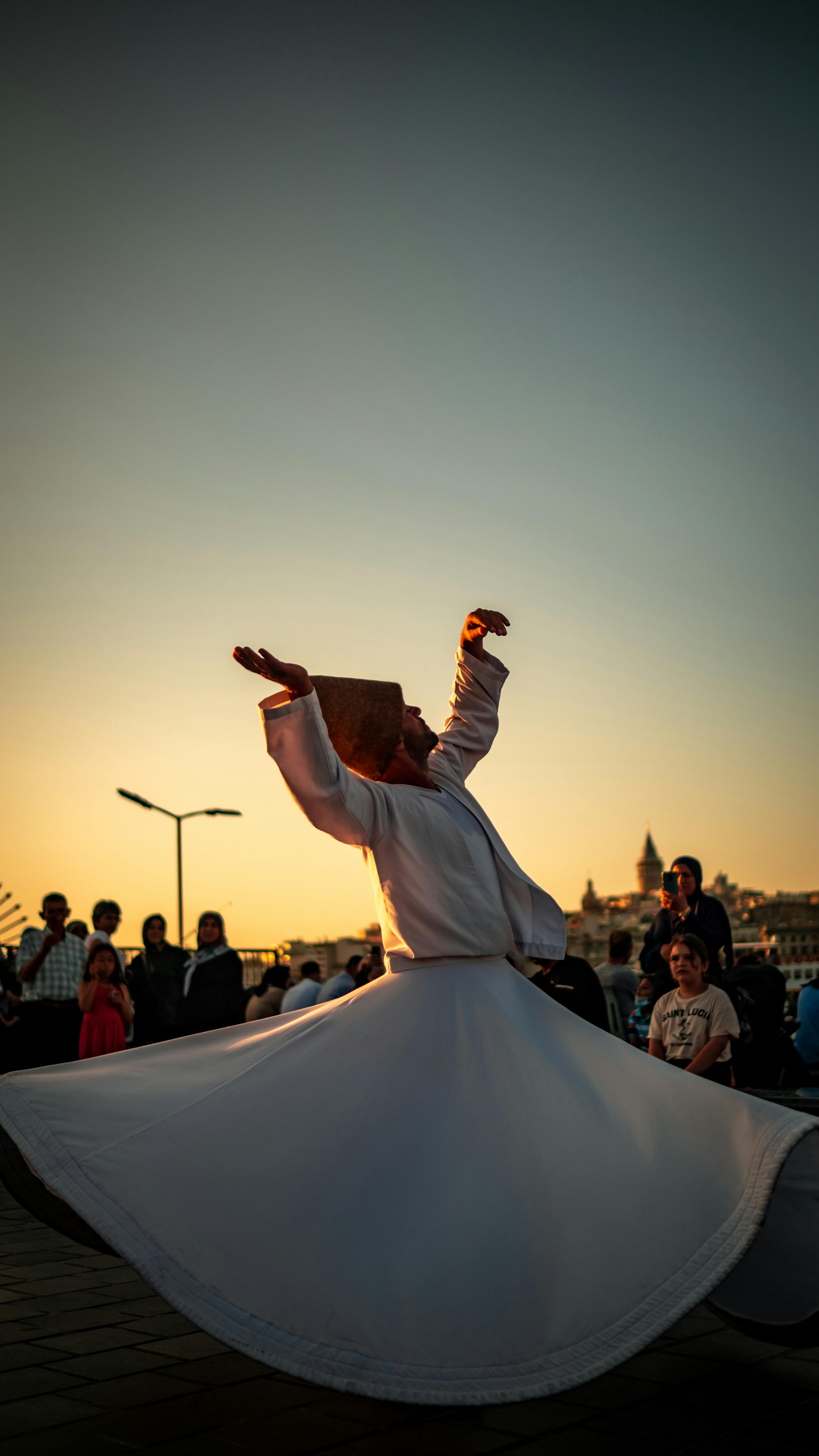 Whirling dervish isolated on black background Stock Photo - Alamy