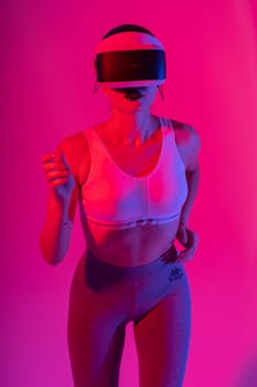Woman wearing VR headset with vibrant pink and blue lighting for a tech-forward gaming experience.