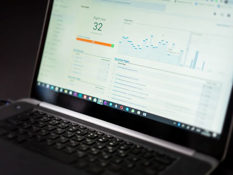 Laptop screen showing an analytics dashboard with campaign performance data