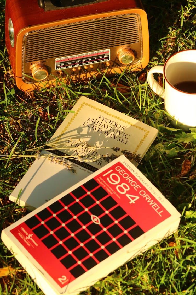 Books Beside A Vintage Radio