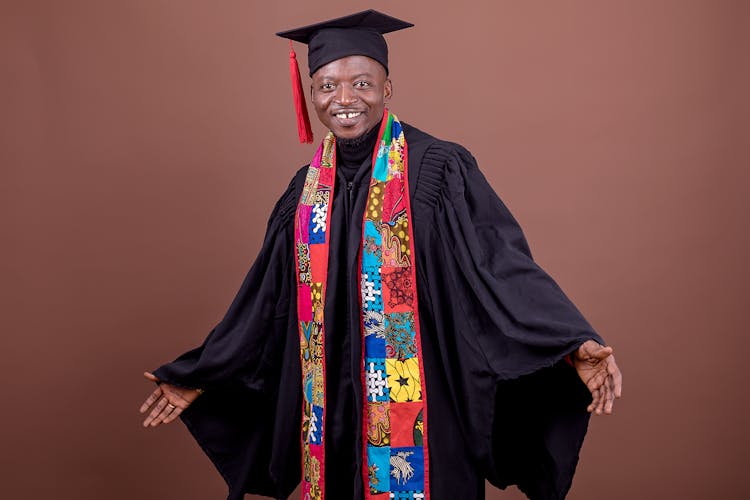 Man In Graduation Mantle And Traditional Accessory