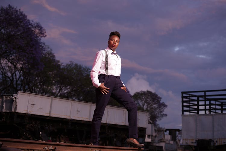 Confident Woman In White Shirt And Bowtie