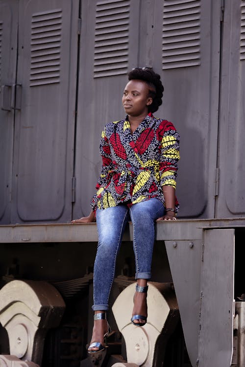 Free Model Posing in Jeans and Blouse against Train Stock Photo