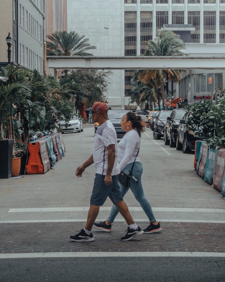 Man And Woman Walking On The Street