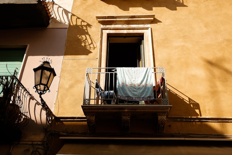 Laundry Drying On Balcony Railing