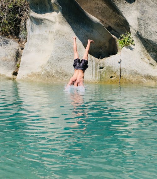 Man Diving into Lake