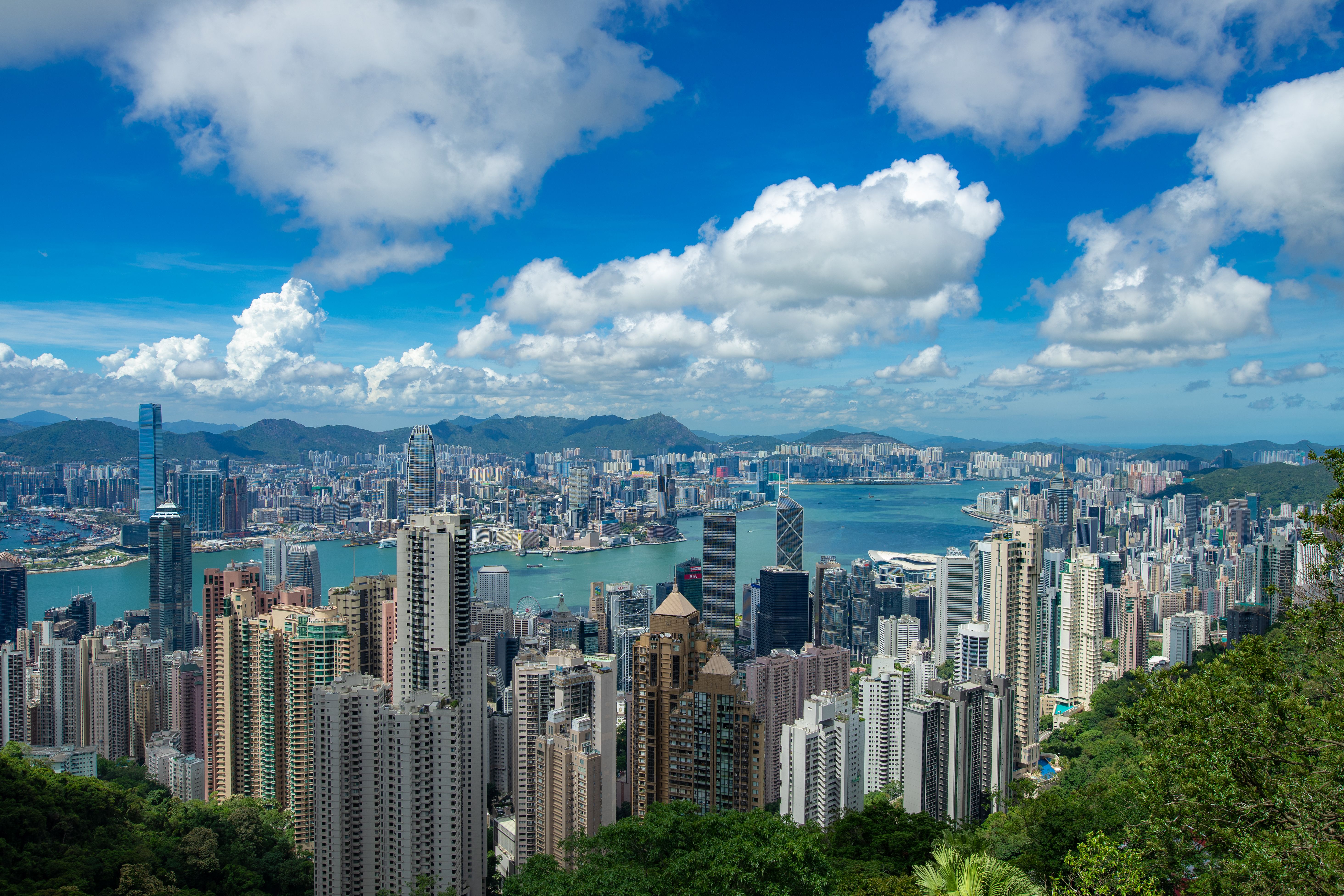 City Skyline Under Blue Sky and White Clouds · Free Stock Photo