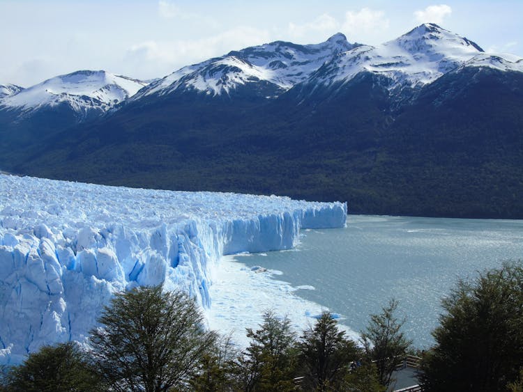 Mountain Landscape And Textured Glacier On A River 