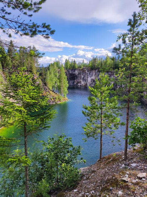 Free Beautiful landscape of Ruskeala Marble Canyon with pine trees and clear water. Stock Photo