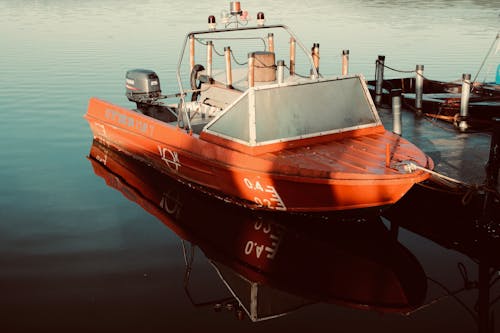 Docked Red Boat on Water 