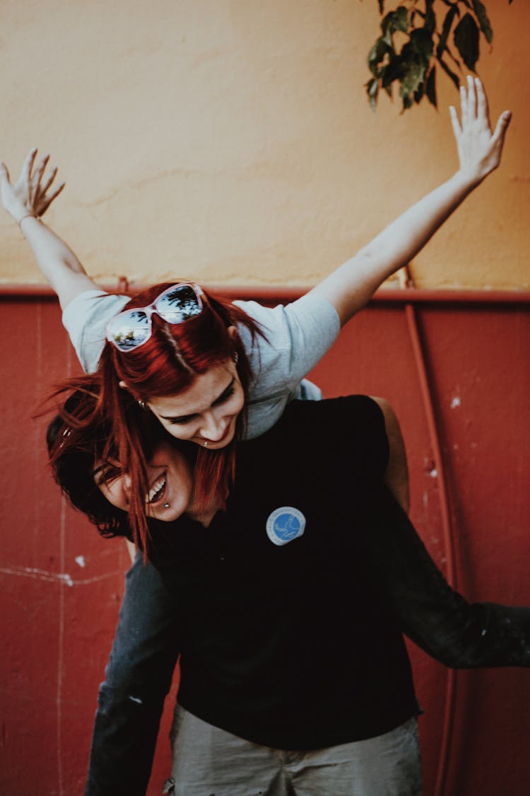 Two Teenage Girls Playing Flying Bird