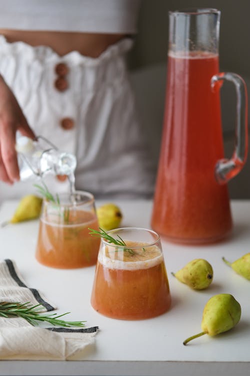 Juice in Glasses and a Jug on a Table