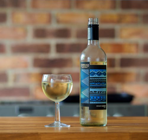 Free A Bottle and a Glass of White Wine Stock Photo