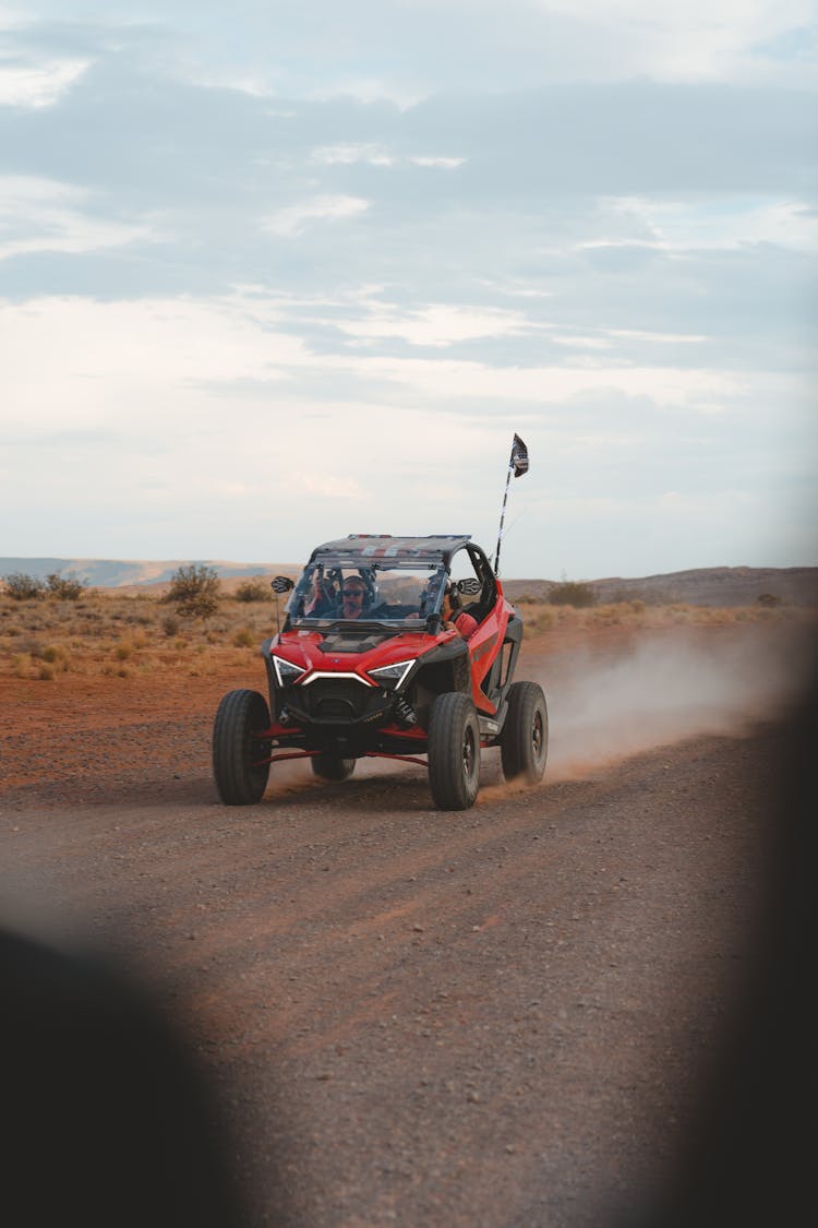 Black And Red Buggy On Dirt Road