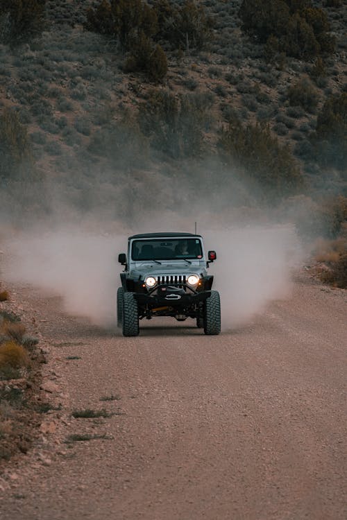 Black and Gray Jeep Wrangler on Dirt Road