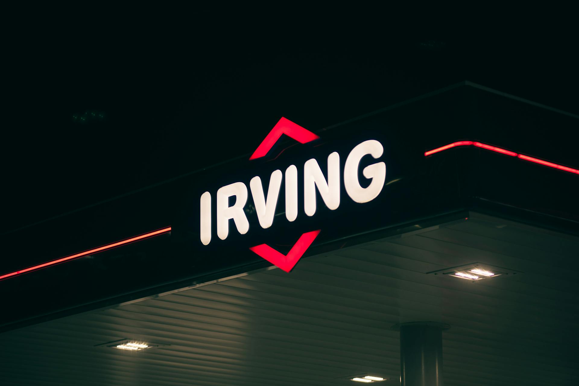 Neon Light of the Irving Oil Company at the Gas Station at Night