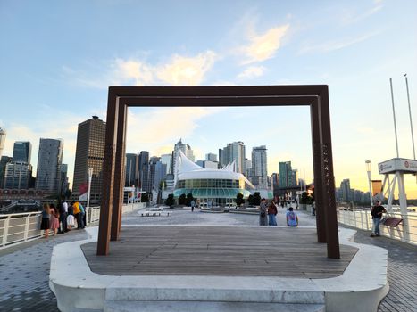 Stunning view of Vancouver's skyline and Canada Place at sunset, highlighting modern architecture.