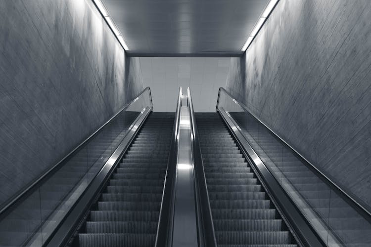 A Grayscale Of Empty Escalators