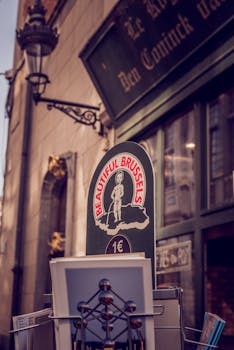 Brussels street scene featuring souvenirs with Manneken Pis and Atomium images.