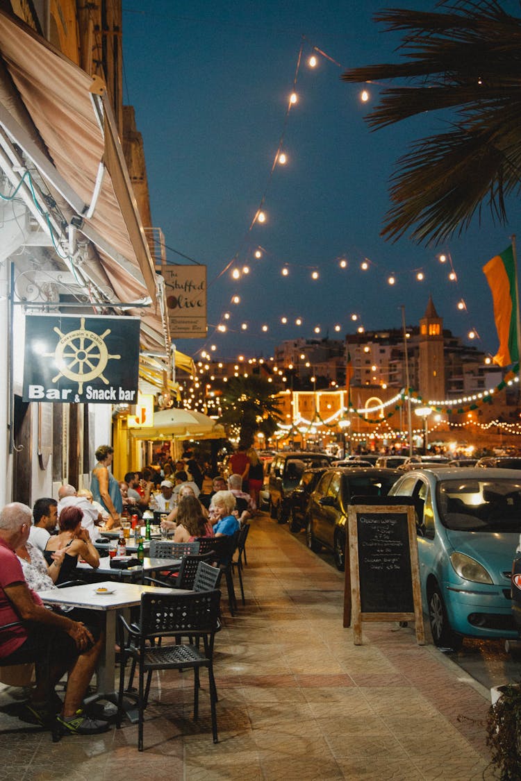 People Eating At Snack Bar Restaurant