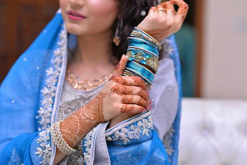 Woman Wearing Blue Traditional Indian Dress and Silk Thread Bangles