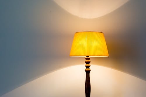 Close-Up Shot of Lampshade on White Wall