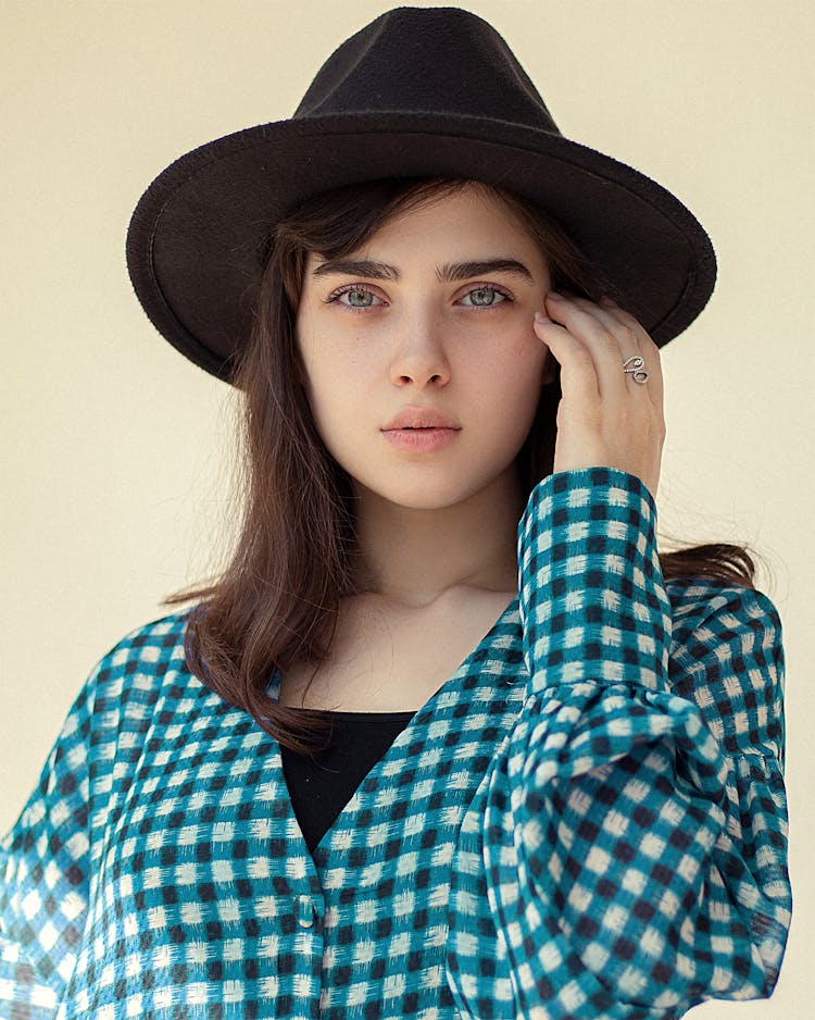 Fashion Woman In Hat And Checkered Shirt