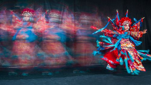 Free Dynamic capture of a Taiwanese opera performer in colorful traditional attire, showcasing cultural heritage. Stock Photo