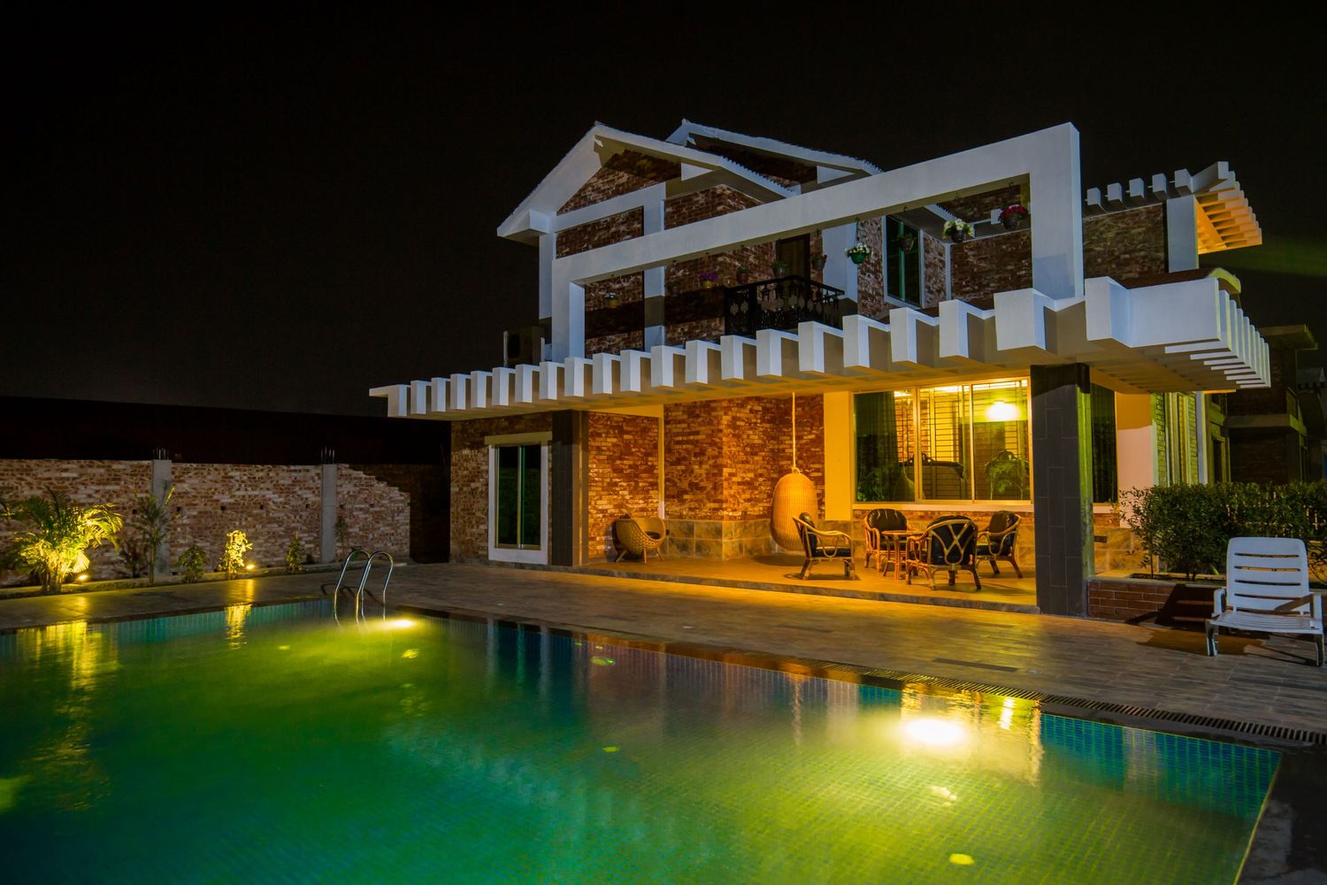 Modern architecture and pool lighting at night