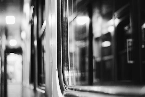 Grayscale Photography of Train Doors