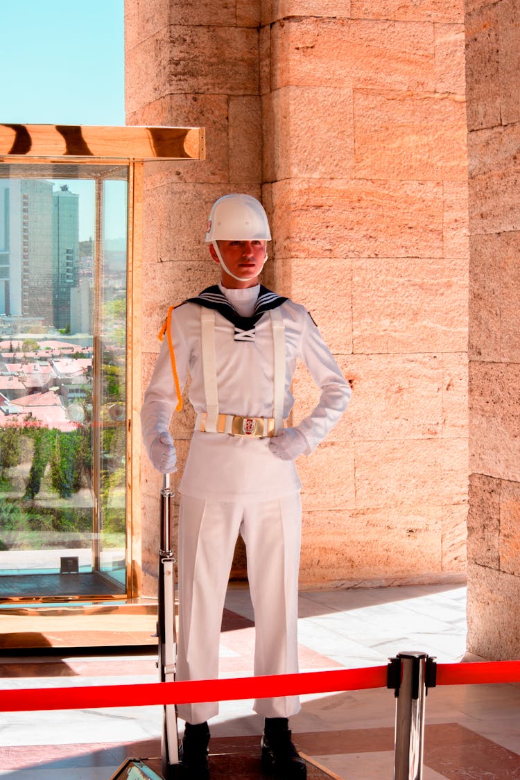 Man In White Uniform Standing Still