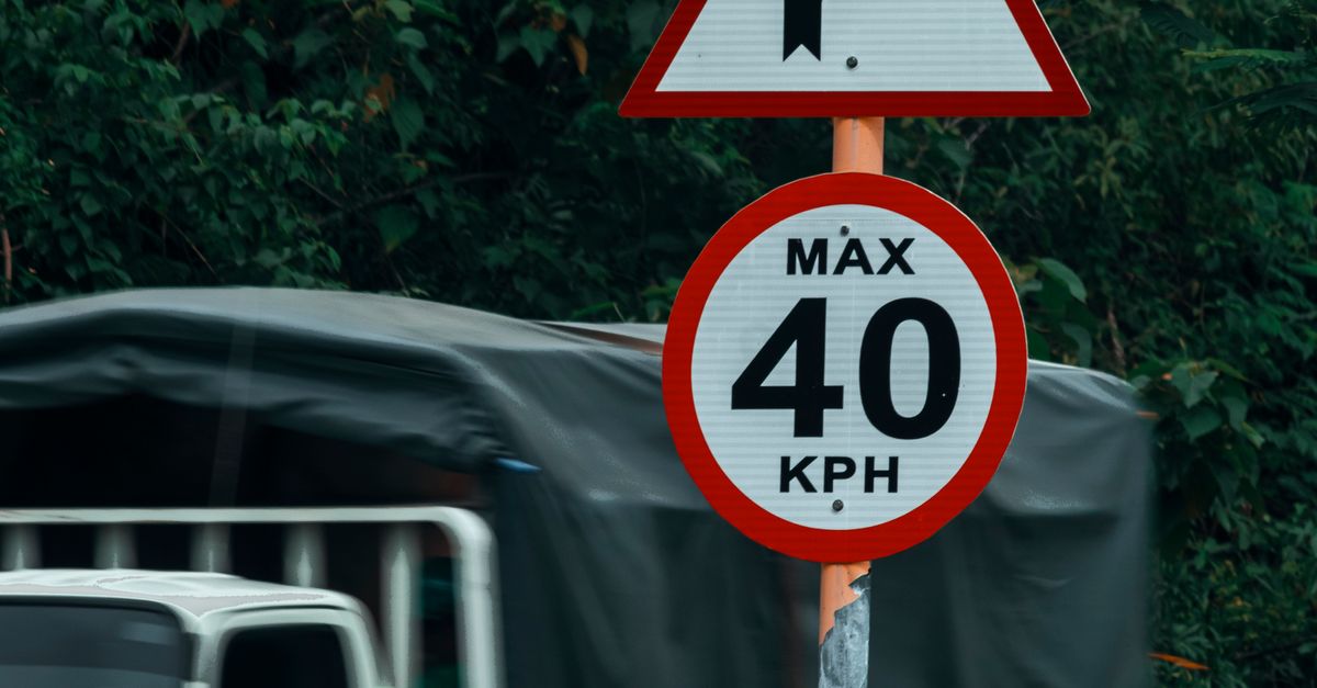 Road Signs on a Steel Post · Free Stock Photo