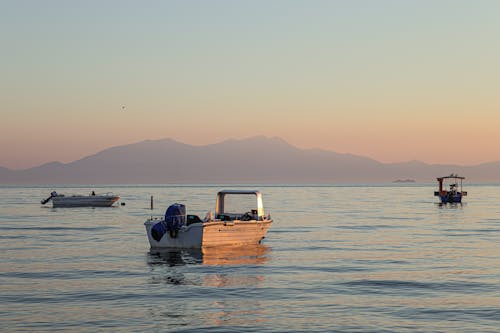 Boats on the Ocean during Sunrise