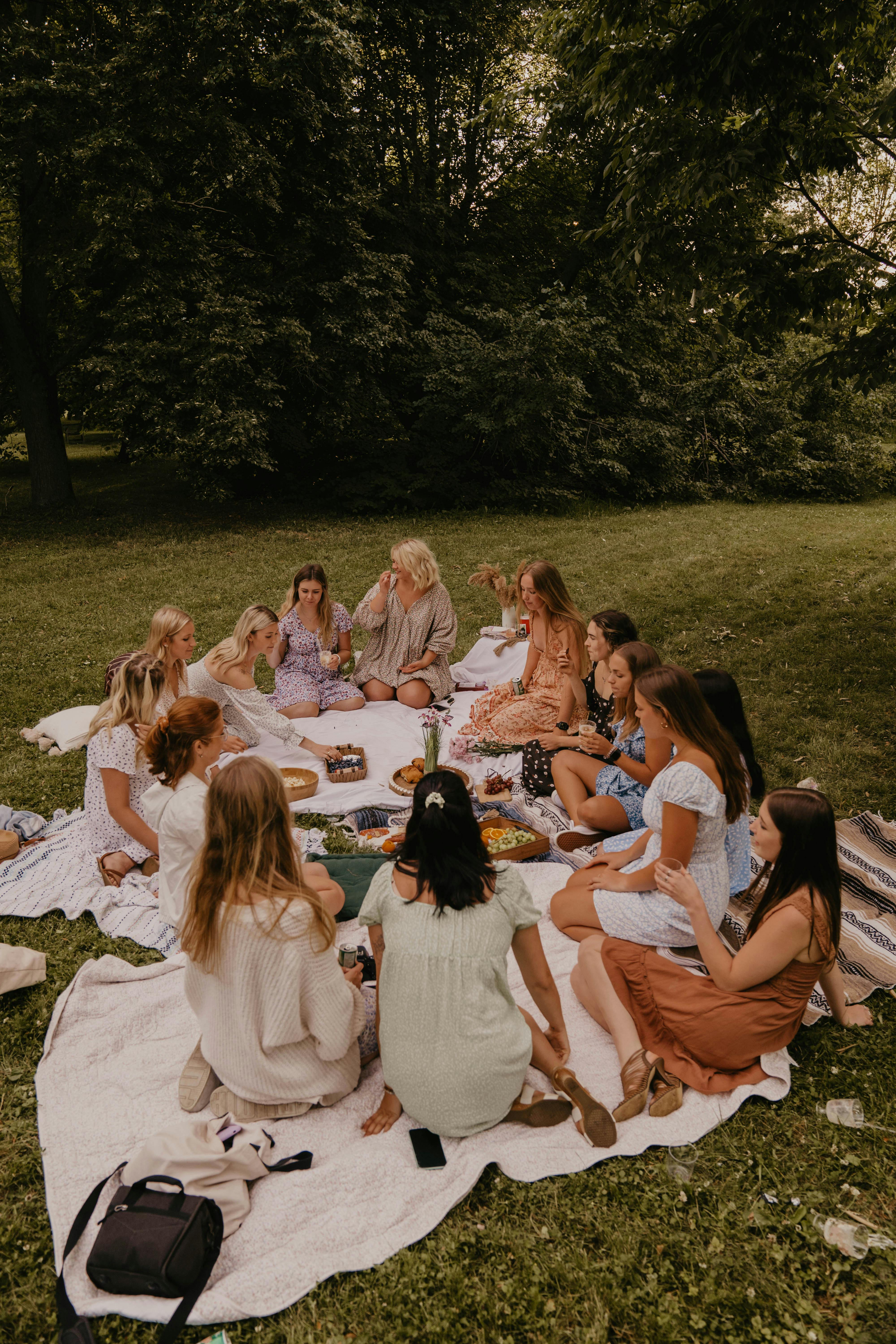 group of women having a picnic in a park