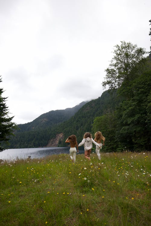 Friends Walking Towards the Lake