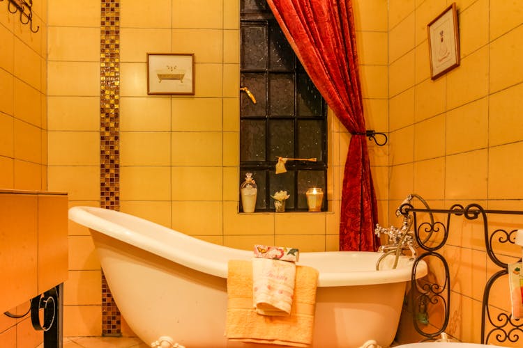 White Ceramic Bathtub In The Bathroom