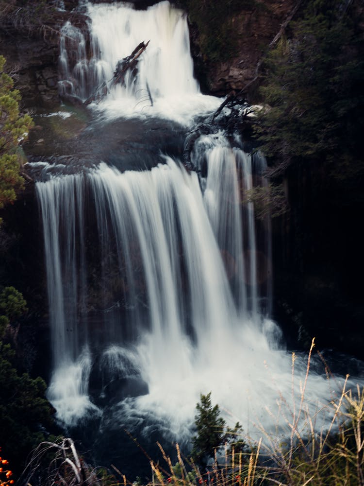 Waterfall Cascade In Mountains