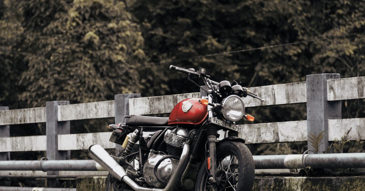 The Motorcycle Parked Near Concrete Railings · Free Stock Photo