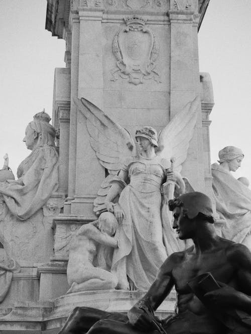 Grayscale Photo of Statues